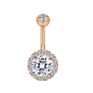 Detailed macro view of rose gold belly button ring with a sparkling halo zircon setting