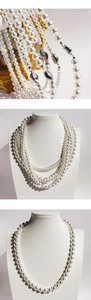Detailed close-up showing the S925 silver clasp on a glossy white pearl necklace
