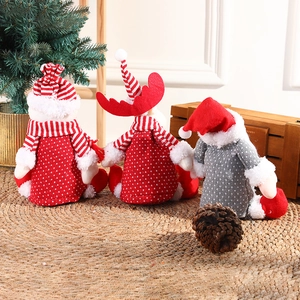 Festive Christmas plush dolls featuring Santa and reindeer designs for holiday home decor