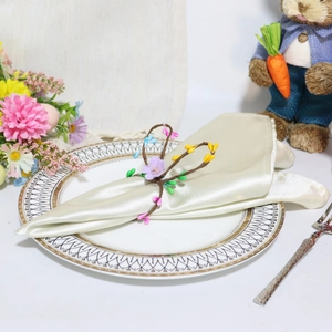 Detail of floral rabbit napkin ring with lavender flowers and buds for Easter dining