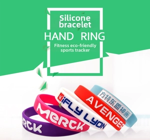 Close-up of assorted colorful silicone wristbands with embossed logo and debossed lettering