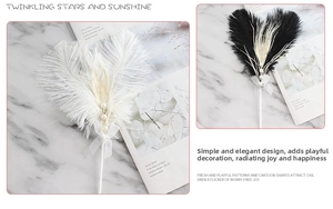 Detail of plush beige ostrich feather heart cake topper with pearls and bow decoration