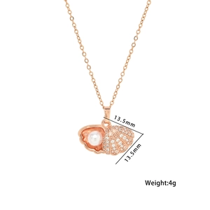 Shell shaped rose gold necklace with pearl and rhinestones, dimensions 13.5mm by 13.5mm