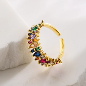 18K gold plated open ring with colorful marquise zircons on white textured stone