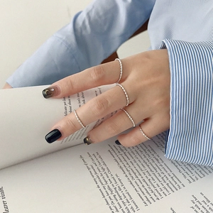Minimalist S925 sterling silver twisted rope rings stacked on a hand for a stylish look
