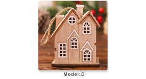 Detail of wooden Christmas house ornament with snow coating and natural jute rope hanger