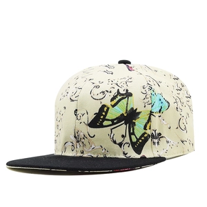 Close-up of hip hop flat brim hat with butterfly prints and black contrast visor