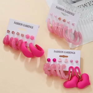 Pink fashion earrings set featuring heart, flower, and acrylic designs on display cards