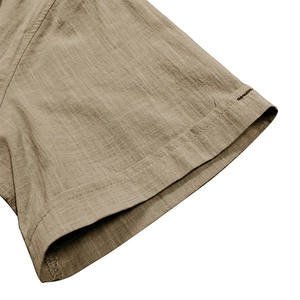 Detailed close-up of khaki cotton linen shirt sleeve showing double stitching and fabric texture