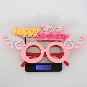 Weight measurement of pink felt Happy Birthday party glasses showing 18.5g on a scale