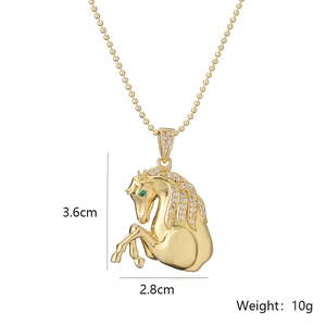 Gold horse pendant necklace with zircon mane and green gemstone eye on ball chain