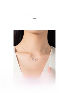 Close-up of S925 sterling silver infinity pendant necklace with pavé zircon stones