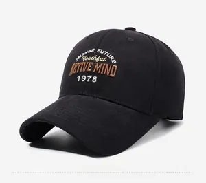 Detailed embroidery on a black cotton baseball cap with classic six-panel stitching
