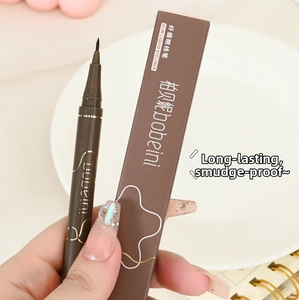 Detailed macro view of 0.05mm ultra-fine liquid eyeliner nib with brown packaging