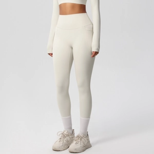 Detail shot of high-waist yoga leggings with a convenient side pocket for mobile phones