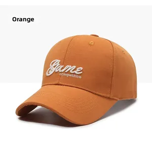 Detail of orange cotton baseball cap with white 3D Game Competitive embroidery