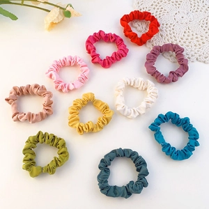 Set of 10 colorful satin scrunchies in assorted shades for elegant ponytail styling