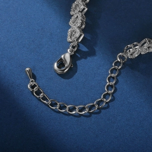 Detailed macro view of the silver lobster clasp and extension chain with zircons