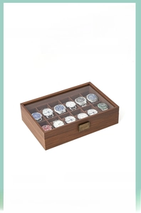 Detail of 12-slot wooden watch display box with clear glass lid and vintage metal lock