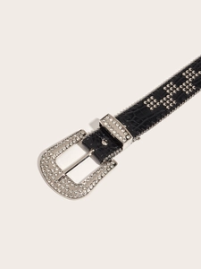 Detail of black crocodile texture belt featuring silver rhinestone buckle and studs