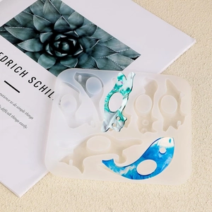 Dolphin resin book page holder silicone mold with finished marble effect resin pieces