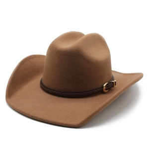 Close-up of brown felt cowboy hat featuring a braided leather band and gold buckle detail