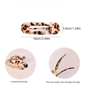 Detailed view of amber acetate hair claw clip with 10cm by 3.4cm dimensions shown