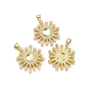 Gold plated heart pendant with shell sunburst and pearls shown from front and back view