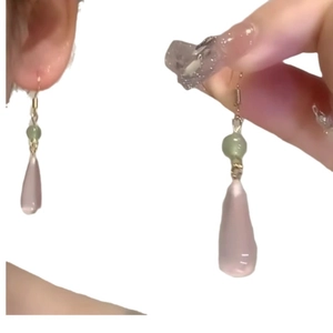 Elegant water drop resin earrings with pink pendant and green bead in gold finish