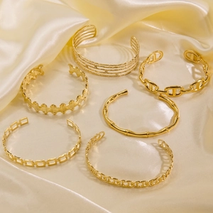 Polished 14K gold-plated titanium steel open bangle set with various minimalist textures
