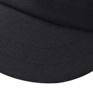 Macro detail of curved double stitching and premium cotton canvas texture on a black cap brim