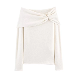 White off-shoulder knitted top with twist knot neckline and gold metallic pin detail
