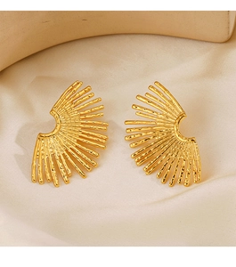 Macro detail of 18K gold plated stainless steel earrings with fan texture on silk