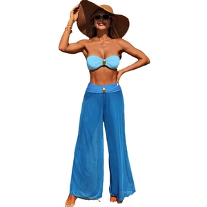 Three-piece light blue bikini set with sheer navy beach pants and gold ring hardware