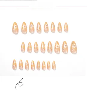 Detailed view of 24pcs almond shape press-on nails with pink gradients and daisy flower motifs