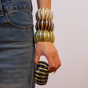 Detailed view of colorful acrylic beaded stretch bracelets with stacked resin pumpkin beads