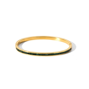 Polished 18k gold plated stainless steel bangle featuring emerald green zircon stones