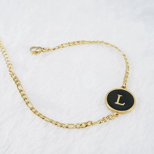 18K gold plated stainless steel bracelet featuring a black shell letter L pendant