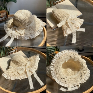Handwoven beige straw sun hat with lace trim and bow ribbon, foldable beach sun hat