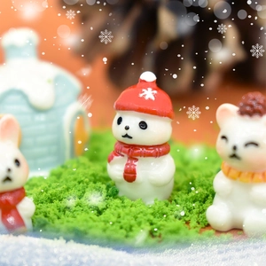 Christmas miniature resin set with snowman, rabbits and house on green moss landscape