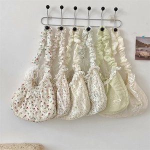 Detail showing various floral pleated shoulder bags with lace trim and vintage style