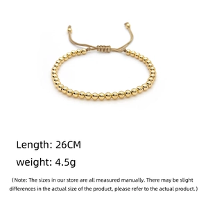 Detail view of adjustable gold beaded bracelet with size metrics and woven knot