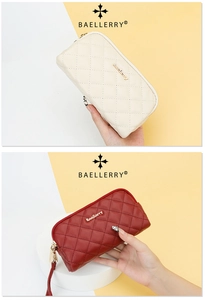 Close-up of quilted faux leather long wallets in beige and dark red with metal zippers