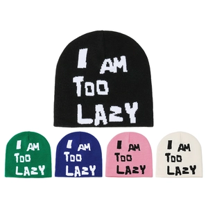 Detail view of knitted beanies in black, green, blue, pink, and white with logo