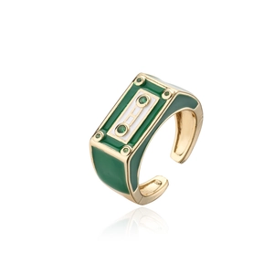 Detail of retro cassette tape ring with green enamel and sparkling zircon stones