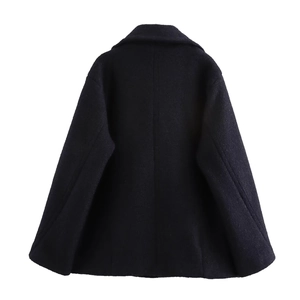 Back view of a black double-breasted wool-blend coat with clean back tailoring