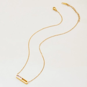 Detailed close-up of gold stainless steel necklace with inlaid lavender zircons