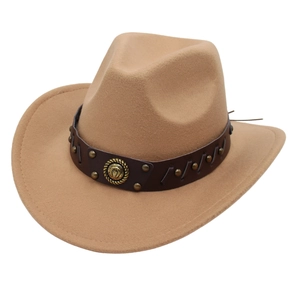 Detail of camel felt cowboy hat featuring faux leather band and golden horseshoe emblem