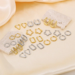 Minimalist geometric earrings in gold and silver showing star, triangle and round shapes