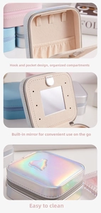 Detail view of holographic heart jewelry box featuring interior mirror and storage hooks